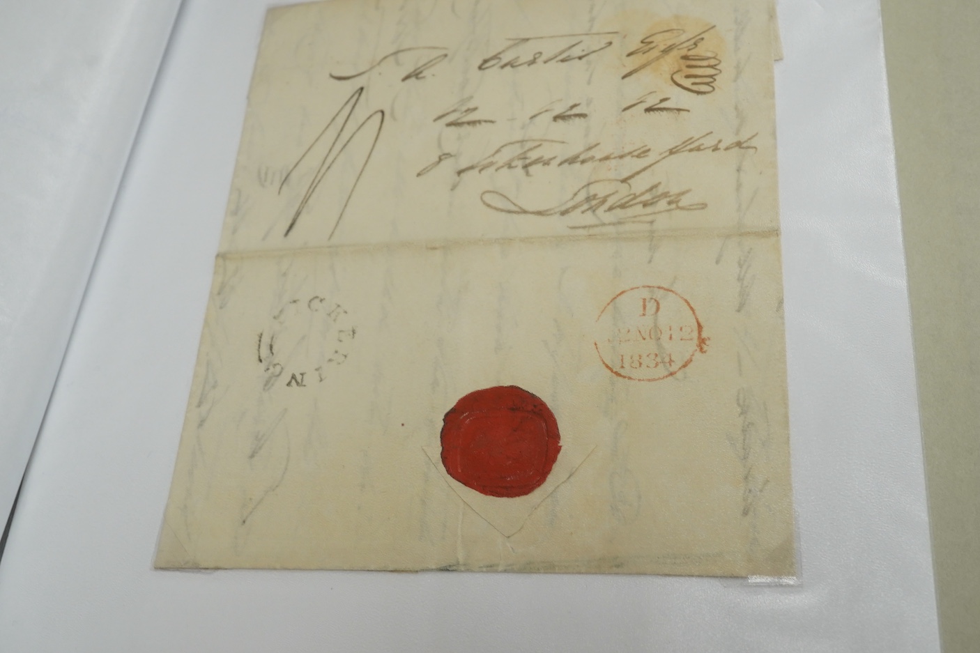 A collection of fifty early nineteenth century Georgian and Victorian franked postal covers, Victoria pre-paid ‘letter cards’ and post cards, railway Dividend Statement, Registered Letters, Fire Office statements, letter